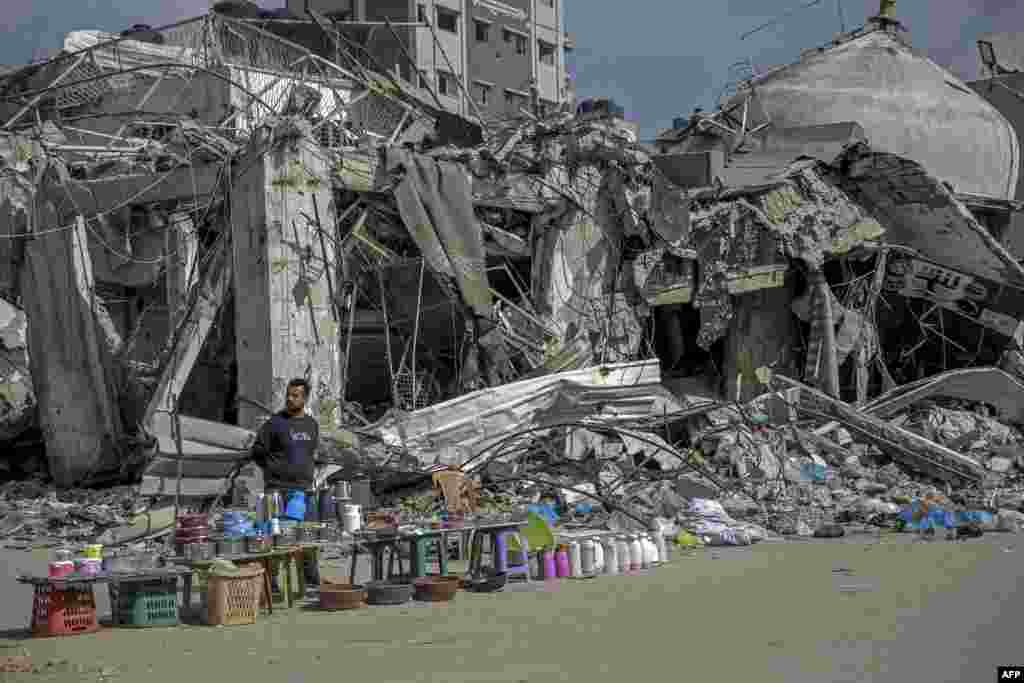 A vendor waits for customers along a street in Gaza City, Feb. 24, 2024, amid the ongoing conflict in the Gaza Strip between Israel and the Palestinian militant Hamas. 