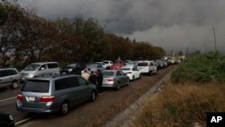Ethnic Armenians from Nagorno-Karabakh wait near Kornidzor, the town in Syunik region, Armenia, Sept. 25, 2023.