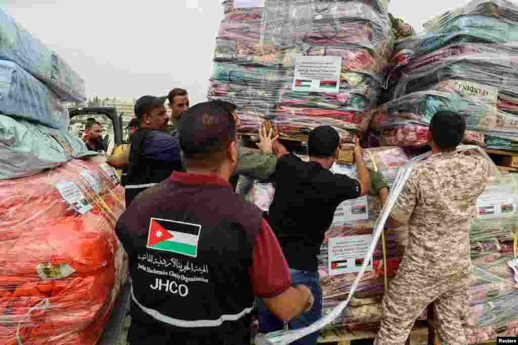 Relief items from Jordan's Hashemite Charity Organization are arranged to be delivered to Libya in response to a powerful storm and heavy rainfall, in Amman, Jordan, Sept. 13, 2023. 