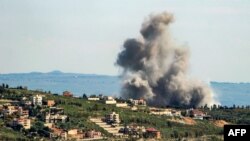 Smoke billows from the area of an Israeli air strike on the southern Lebanese village of Khiam near the border with Israel on Apr. 8, 2024, amid ongoing cross-border tensions. 