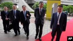 Chinese Finance Minister Liu Kun, second from right, attends the G20's meeting for finance ministers in Gandhinagar, India, July 18, 2023. China, along with Russia, objected to referring to the war in Ukraine as causing “immense human suffering” and “exacerbating existing fragilities in the global economy.”