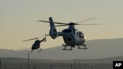 Helicopter recovery teams depart the Michael Army Air Field before the arrival of a space capsule carrying NASA's first asteroid samples, Sept. 24, 2023.