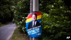 A election campaign poster of far-right AfD candidate Robert Sesselmann remains at a street at the outskirts of the small city of Sonneberg at the German federal state Thuringia, July 5, 2023.