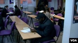 West African migrants applying for legal status in France. (Lisa Bryant/VOA)