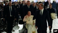 Pope Francis arrives in St. Peter's Square to pray in front of the Nativity scene after celebrating a New Year's Eve vespers Mass in St. Peter's Basilica at the Vatican, Dec. 31, 2023.