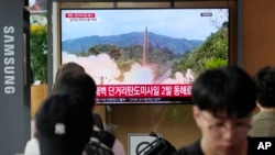 A TV screen shows a file image of North Korea's missile launch during a news program at the Seoul Railway Station in Seoul, South Korea, July 19, 2023. North Korea fired two short-range ballistic missiles into its eastern sea early Wednesday.