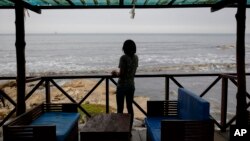 FILE - Efua, a 25-year-old fashion designer and single mother in Ghana who became pregnant in 2023, poses for a photo in Accra, Ghana, March 19, 2024.