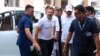 India's opposition Congress Party leader Rahul Gandhi, second-left, arrives at a court in Surat, India, March 23, 2023.