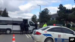 Police officers block a road outside the Procter & Gamble factory near Gebze, northwest Turkey, Feb. 1, 2024.