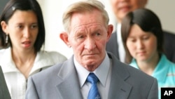 FILE - Former U.S. Army deserter to North Korea, Charles Jenkins, is seen with his daughters Mika, rear left, and Brinda at Narita International Airport, Japan, June 14, 2005.