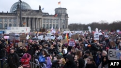 Demonstrators protest against the far-right Alternative for Germany party outside the Reichstag building in Berlin, Germany, Feb. 3, 2024.