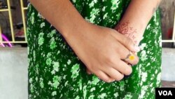 Prodeepa, a child marriage and trafficking survivor, in her East Midnapore neighborhood. Like many other economically challenged survivors, she has received no legal aid from authorities. (Sarah Aziz/VOA)