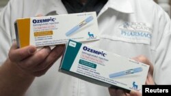 FILE - A pharmacist displays boxes of Ozempic, a drug used for treating type 2 diabetes and obesity made by Novo Nordisk, at Rock Canyon Pharmacy in Provo, Utah, March 29, 2023. 