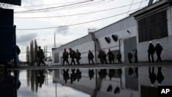 Miners walk out of the pit-face at the coal mine in Dnipropetrovsk region, Ukraine, April 7, 2023.