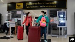 FILE - Chinese tourists arrive at Chiang Mai international airport in Chiang Mai province in northern Thailand, January 23, 2023. (AP Photo/Wichai Thaprieo)