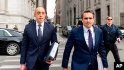 Attorneys for former President Donald Trump Emil Bove, left, and Todd Blanche, right, exit the New York State appellate court, April 8, 2024, in New York.