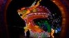 Siluet seorang pria berjalan melewati patung naga di pekan raya tahun baru Imlek di Beijing, China. 10 Februari ini warga Tionghoa memasuki Tahun Naga menggantikan Tahun Kelinci.