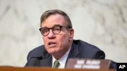 FILE - Chairman Mark Warner speaks during a Senate Intelligence Committee hearing at the Capitol in Washington, March 8, 2023.