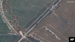 This satellite image provided by Maxar Technologies shows fortifications and dragons in Medvedivka, Crimea, Feb. 11, 2023.