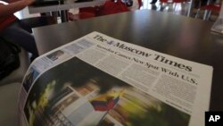 FILE - A copy of The Moscow Times newspaper is seen at a cafe in Sheremetyevo airport, Moscow, June 26, 2013. Russia's Justice Ministry on Nov. 17, 2023, added The Moscow Times, an online newspaper popular among Russia's expatriate community, to its list of "foreign agents."
