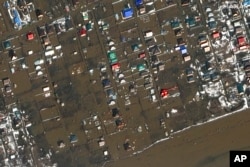 This image provided by Maxar Technologies, shows flooded areas in Orenburg, Russia, Wednesday, April 3, 2024. (Satellite image ©2024 Maxar Technologies via AP)