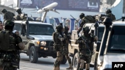 FILE - Afghan security personnel arrive at the Kabul airport in Kabul, Feb. 12, 2024. The Taliban government confirmed, March 31, 2024, they had detained 'a number of foreign citizens, including two Americans' for allegedly violating their laws. 