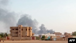 FILE - Smoke billows in the distance around the Khartoum Bahri district amid ongoing fighting in Sudan on July 14, 2023. 