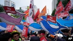 Members of South Korean Confederation of Trade Unions struggle with police officers during a rally against the Japanese government's decision to release treated radioactive water from Fukushima nuclear power plant, in Seoul, South Korea, July 6, 2023.
