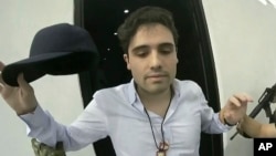 FILE - This frame grab from video, provided by the Mexican government, shows Ovidio Guzman Lopez being detained in Culiacan, Mexico, Oct. 17, 2019. 