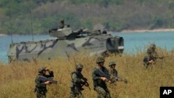 
Thai soldiers land with an amphibious assault vehicle on the beachhead during the Cobra Gold U.S.-Thai joint military exercise on Hat Yao beach in Chonburi province, eastern Thailand, Friday, March 3, 2023.