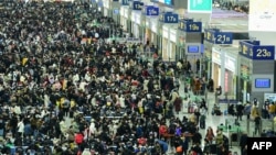 Passengers gather at the Shanghai Hongqiao railway station in Shanghai on Feb. 3, 2024, during peak travel ahead of the Lunar New Year of the Dragon, which falls on February 10.
