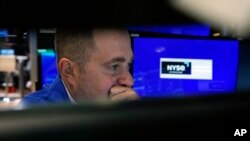 Specialist Gennaro Saporito works on the floor of the New York Stock Exchange, Nov. 1, 2023. U.S. stocks are drifting Wednesday as Wall Street waits to hear what will come out of the Federal Reserve's latest announcement on interest rates. 