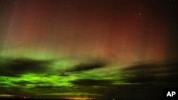 FILE - An aurora borealis, also known as the northern lights, is seen in the night sky April 24, 2023, near Washtucna, Wash. 