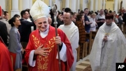 FILE - Cardinal Matteo Zuppi welcomes parishioners after celebrating Mass at the Cathedral of the Immaculate Conception in Moscow, June 29, 2023. Pope Francis’ peace envoy was traveling to Washington on July 17, 2023.