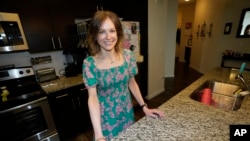 Kathleen Rickerson poses for a photo at her home, May 24, 2023, in the west Denver suburb of Lakewood, Colorado.