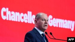German Chancellor Olaf Scholz speaks at the Romanian Parliament's headquarters during the "We stand together for our Europe!" conference and leaders meeting organized by The Party of European Socialists in Bucharest, Romania, April 6, 2024.