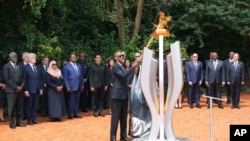 FILE - Rwandan President Paul Kagame lights a memorial flame during a ceremony to mark the 30th anniversary of the Rwandan genocide, held at the Kigali Genocide Memorial, in Kigali, Apr. 7, 2024. 