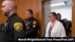Jennifer Crumbley walks into an Oakland County courtroom before being found guilty on four counts of involuntary manslaughter on Feb. 6, 2024 in Pontiac, Michigan. (Mandi Wright/Detroit Free Press via AP/Pool)