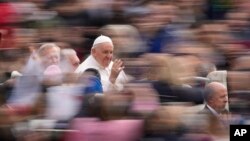 FILE - Pope Francis arrives for his weekly general audience in St. Peter's Square at the Vatican, March 8, 2023. Pope Francis travels to the periphery of Roman Catholicism this summer when he becomes the first pontiff to visit Mongolia.