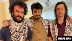 FILE - Hisham Awartani, Kinnan Abdel Hamid and Tahseen Ahmed, three college students of Palestinian descent who were shot near the University of Vermont in Burlington on Nov. 25, 2023 are seen in this undated handout photo. 