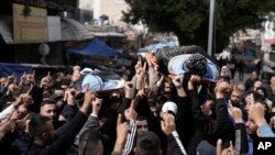 ជនសកម្មប្រយុទ្ធសែងសាកសព Said Jaradat និង Yasser Hanoun នៃក្រុម​ Jihad ដែលត្រូវបានសម្លាប់ដោយដ្រូន​របស់​អ៊ីស្រាអែល​ នៅតំបន់ West Bank កាលពីថ្ងៃទី២៣ ខែកុម្ភៈ ឆ្នាំ២០២៤។ 