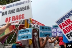 People protest outside of the Supreme Court in Washington, Thursday, June 29, 2023. The Supreme Court on Thursday struck down affirmative action in college admissions, declaring race cannot be a factor and forcing institutions of higher education to look for new ways to achieve diverse student bodies. (AP Photo/Jose Luis Magana)