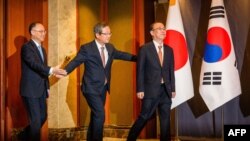(L-R) China's Deputy Minister of Foreign Affairs Nong Rong, South Korean Deputy Foreign Minister Chung Byung-won and Japan's Senior Deputy Minister for Foreign Affairs Funakoshi Takehiro meet in Seoul on Sept. 26, 2023. 