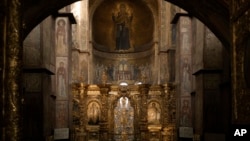 FILE - Paintings decorate the walls of the Saint Sophia Cathedral, a UNESCO World Heritage Site in Kyiv, Ukraine, March 26, 2022. 