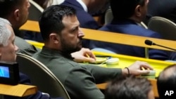 Ukraine President Volodymyr Zelenskyy listens to US President Joseph Biden address the 78th session of the United Nations General Assembly, Sept. 19, 2023.
