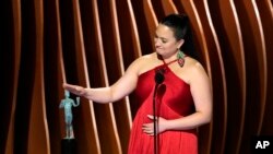 Lily Gladstone accepts the award for outstanding performance by a female actor in a leading role for 'Killers of the Flower Moon' during the 30th annual Screen Actors Guild Awards on Feb. 24, 2024, at the Shrine Auditorium in Los Angeles.