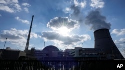FILE - Water vapor rises from the RWE nuclear power plant Emsland in Lingen, western Germany, March 18, 2022.