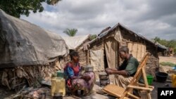 FILE - People displaced by conflict sit in a camp in Komanda, Ituri province, eastern Democratic Republic of the Congo, Aug. 30, 2023. There are over 6 million internally displaced people in the DRC.