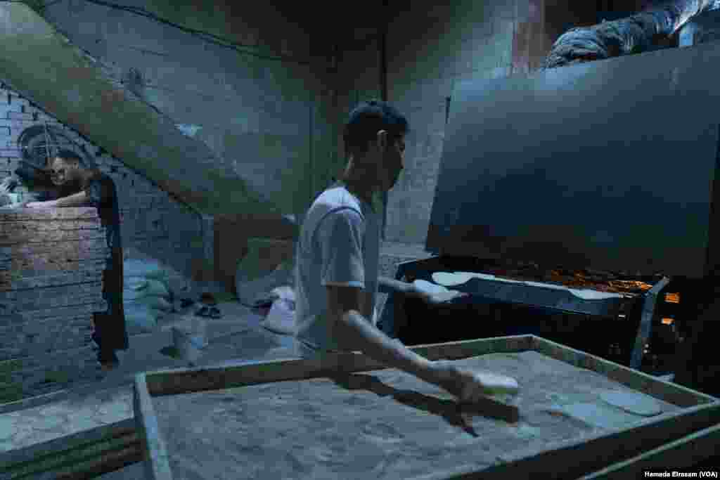 Youssef and Mostafa, friends from Upper Egypt, work in a subsidized bakery for about $4 a day. &ldquo;The new price of bread is unbearable for many people,&rdquo; says Youssef. &ldquo;We&rsquo;re lucky to receive some free loaves from work.&rdquo; Cairo, Egypt, June 24, 2024.&nbsp;(Hamada Elrasam/VOA)