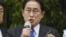 Japanese Prime Minister Fumio Kishida delivers a speech to support his ruling party’s candidate in a local election, near a train station in Wakayama, western Japan, April 15, 2023.